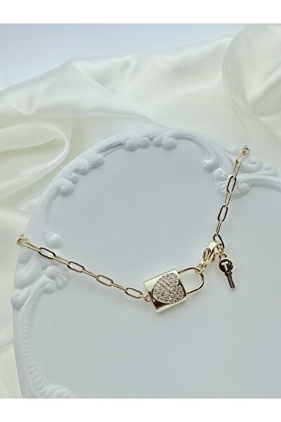 Snartun سوار نسائي من الفولاذ الذهبي مع تفاصيل حجرية وتصميم قفل ومفتاح |   صن...