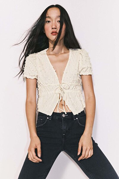 H&M بلوزة بلوميتي برباط أمامي