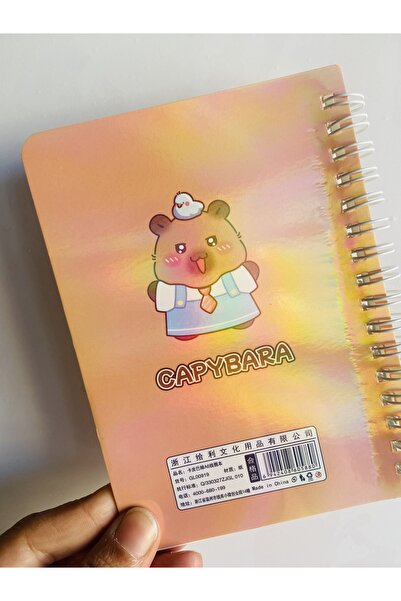 synshop Capybara notebook - spiral bound, lined, gold foil accents, glossy cover - 15x11 cm