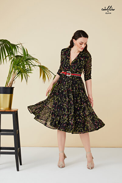 Stylish Elegant black midi dress with a wide cut, decorated with delicate embroidery in beautiful fabric