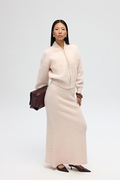 MAI STUDIOS CO. تنورة تريكو طويلة باللون الوردي من نيفرا