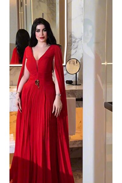 Riva Long, flowing red evening dress with an elegant cape cut and a deep neckline