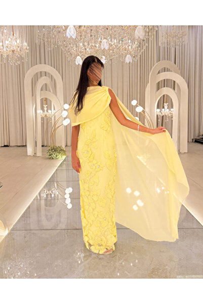 Generic Yellow evening dress embroidered with flowers and an elegant side shawl