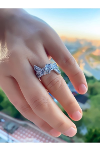 VEGALUXE Steel Bow Zircon Stone Silver Color Ring Adjustable to Fit the Finger. Does Not Tarnish.