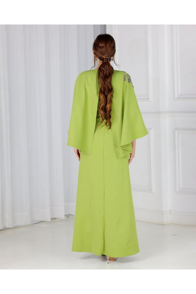 NAN Apple green dress with embellishments on the shoulder and waist