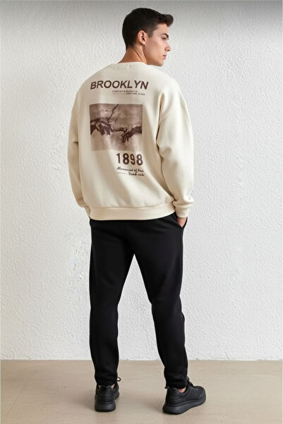 UNCİA OUTDOORS رقبة دائرية كبيرة الحجم مطبوعة يدويًا للجنسين