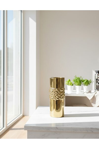 Generic A decorative gold-colored flower vase adds radiance and elegance to your table or room. Comes without the flowers.