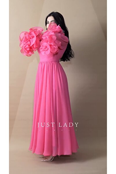 Riva Elegant pink evening dress with puffy sleeves and lots of ruffles.