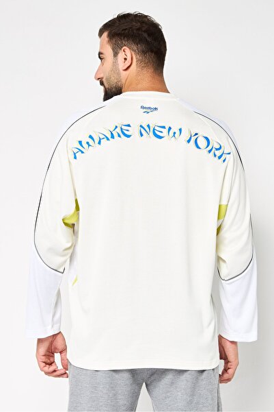 Reebok قميص هوكي رياضي رجالي بأكمام طويلة، لون أبيض فاتح
