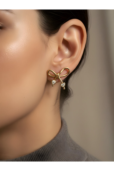 TURBİJ أقراط ذهبية فاخرة بتصميم فيونكة مع تفاصيل حجرية |   أقراط عصرية |   أق...