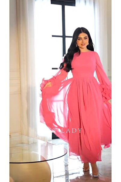 Riva Elegant pink evening dress with puffy sleeves and lots of ruffles.