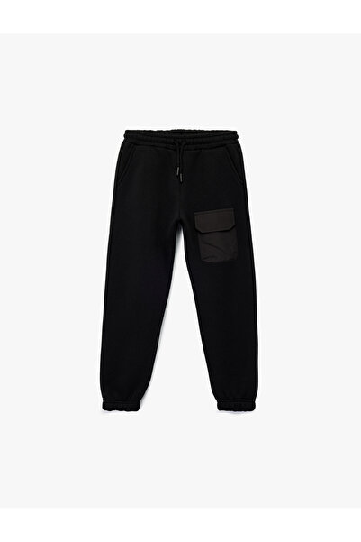 Koton Βασικό παντελόνι Jogger με λεπτομέρεια τσέπης με αποκάλυψη