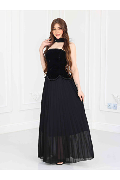 ZAYIA A strapless, formal maxi evening gown in pleated black velvet chiffon, ...