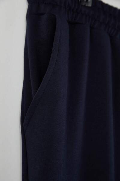 Trendyol Collection Navy Blue Straight Cut Elasticated Leg Plus Size Sweatpants Tmnss24Aj00001