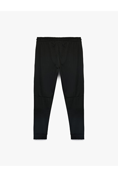 Koton Sportovní tepláky Jogger s kapsami na zavazování v pase a detaily prošívání