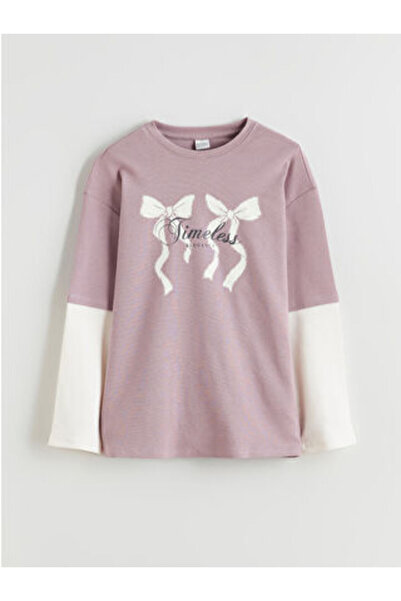 LC Waikiki تي شيرت جديد للفتيات بطباعة فيونكة على شكل ياقة الدراجة من الموسم ...