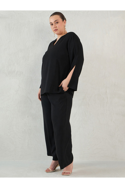 Femmella By Styli طقم بلوزة وبنطلون بأكمام شق الأسود بمقاسات كبيرة