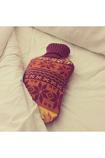 Generic Hot water bottle with a knitted fabric cover. The cover features a warm, woven winter fabric pattern.