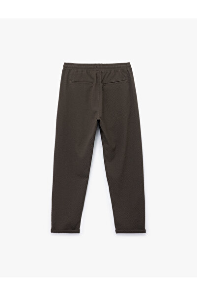 Koton Viskon Karışımlı Cep Detaylı Dokulu Beli Bağcıklı Pantolon