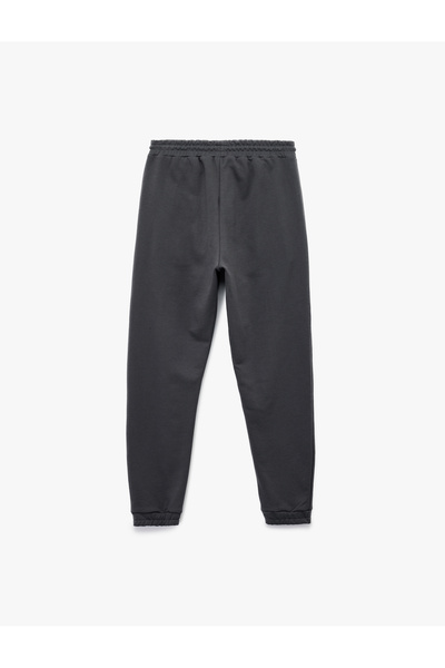 Koton Bavlněné tepláky Jogger s detailem kapsy a šněrováním v pase