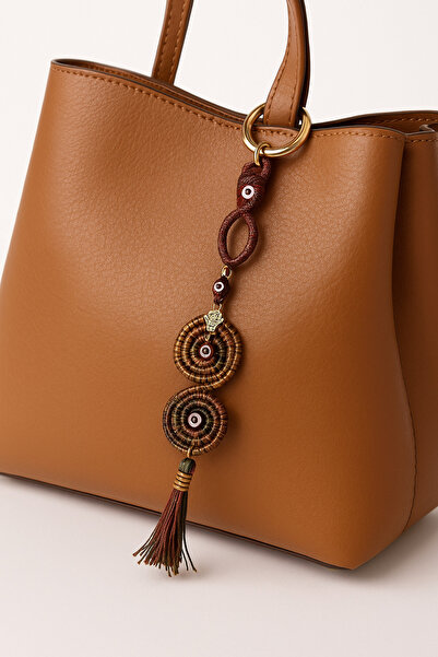 She Sells تميمة حماية من العين الشريرة مصنوعة يدويًا مع تفاصيل من الخرز والشرابة