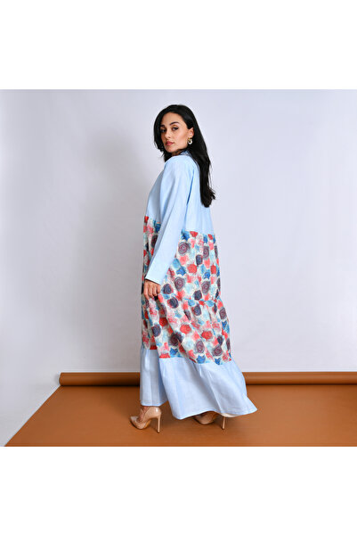 Oya.sa Blue abaya designed with linen fabric, with a semi-flared design and a patterned fabric overlay.