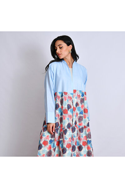 Oya.sa Blue abaya designed with linen fabric, with a semi-flared design and a patterned fabric overlay.