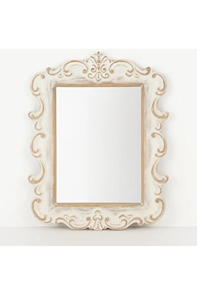 Vi Markets A mirror with an ornate wooden frame adds a classic touch of luxury to the space.
