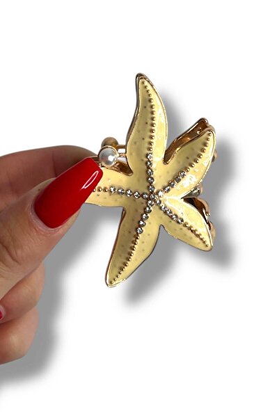 TAKIŞTIR Μεταλλικό κούμπωμα με λεπτομέρεια από μαργαριτάρι σε κρεμ χρώμα με φιγούρα αστερίας θάλασσας