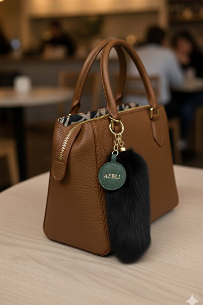 Modex Αξεσουάρ τσάντας με μακρύ φτερό σε ασημί χρώμα (15 εκ.)