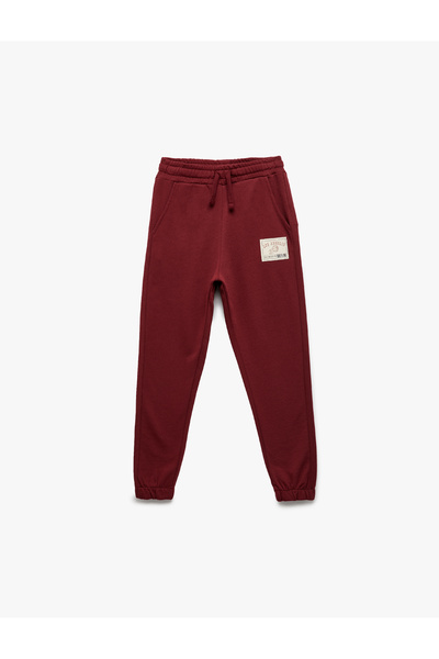 Koton بنطال رياضي للأولاد باللون العنابي