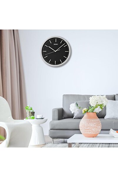 007 ساعة حائط سيكو QHA009S أنيقة دائرية تناظرية، هيكل بلاستيكي فضي مع مينا سوداء