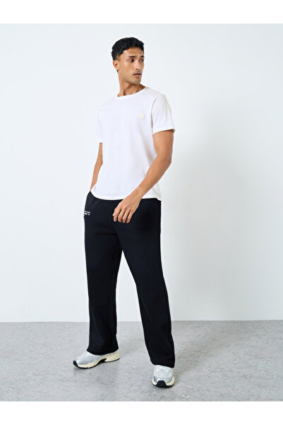 Styli Men Black Slogan Print Oversized Joggers