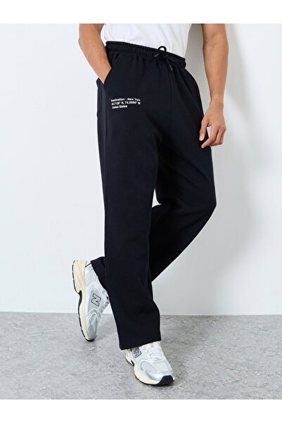 Styli Men Black Slogan Print Oversized Joggers