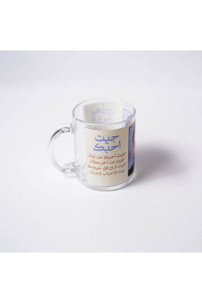 Story of candle A clear glass cup with "Majid Al Mohandes with two of his best songs"
