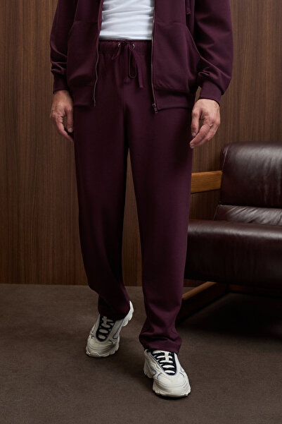 GRIMELANGE Griffin Men's Burgundy Sweatpants with Elastic Waistband and Metal Bird's Eye Detail