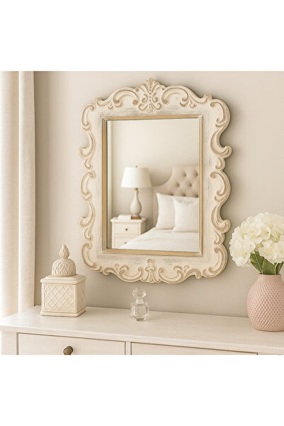 Vi Markets A mirror with an ornate wooden frame adds a classic touch of luxury to the space.
