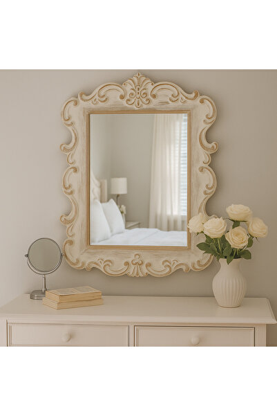 Vi Markets A mirror with an ornate wooden frame adds a classic touch of luxury to the space.