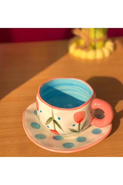 WarD Cup and saucer from Koythin porcelain featuring an elegant floral design.