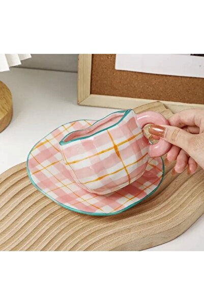 WarD Cup and saucer from Koythin porcelain featuring an elegant floral design.