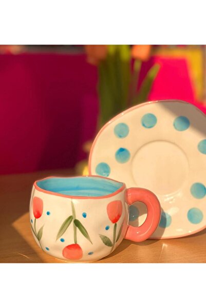 WarD Cup and saucer from Koythin porcelain featuring an elegant floral design.