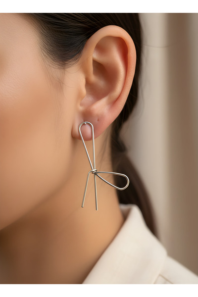 TURBİJ أقراط نسائية فضية اللون على شكل فيونكة بتصميم بسيط