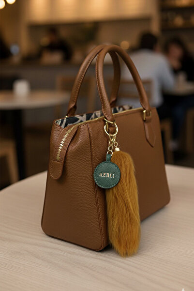 Modex Αξεσουάρ τσάντας με μακρύ φτερό σε ασημί χρώμα (15 εκ.)