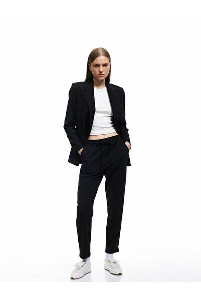 Koton بنطلون نسائي أسود بقصّة الجزرة