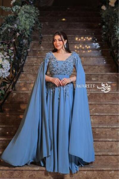WAREEF FASHION Blue evening dress decorated with roses
