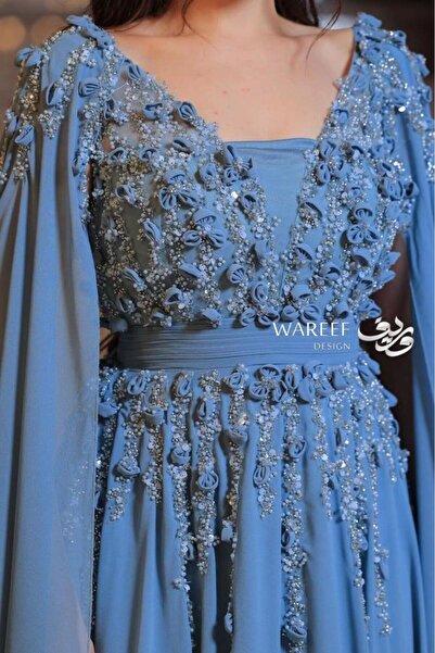 WAREEF FASHION Blue evening dress decorated with roses