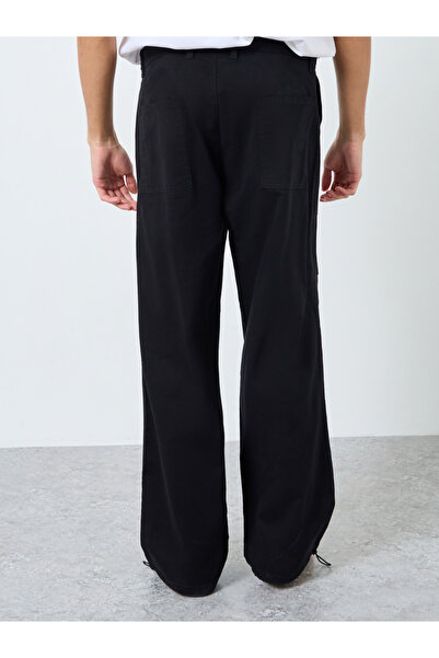 Styli Men Black Relaxed Fit Paneled Pants