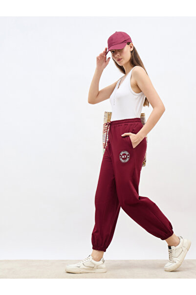 Styli Burgundy Tapered Joggers with Graphic Print