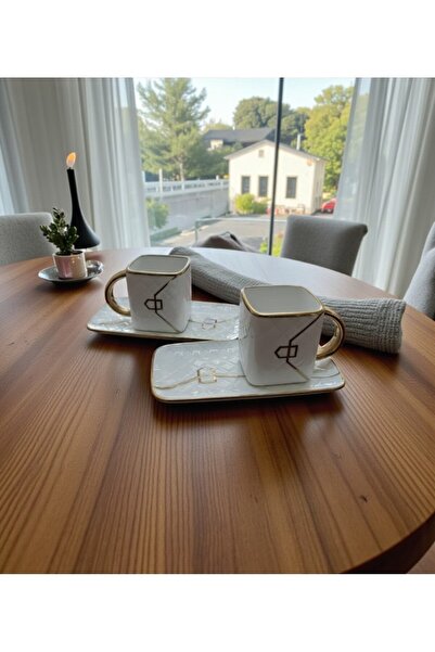 lstri طقم أكواب من طراز حقيبة مطلية بالذهب من البورسلين مكون من قطعتين