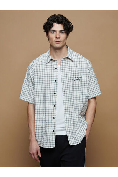 LC Waikiki A Men's Short-Sleeved Checked Embroidered Shirt with a Relaxed Fit...